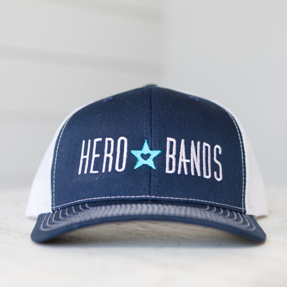 navy blue trucker hat embroidered with hero bands logo
