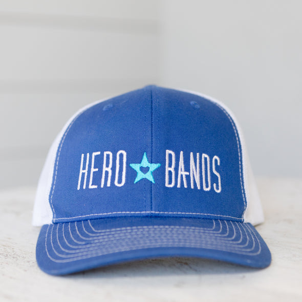 royal blue trucker hat embroidered with hero bands logo