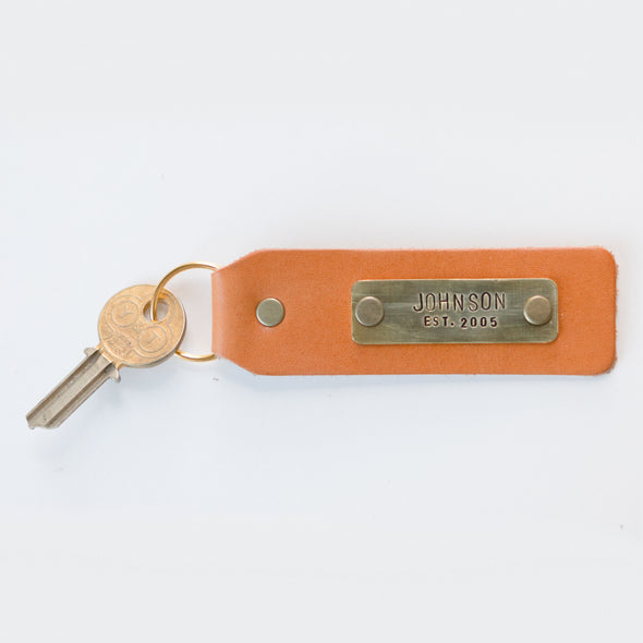 keychain stamped with name and date