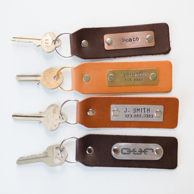 four leather keychains